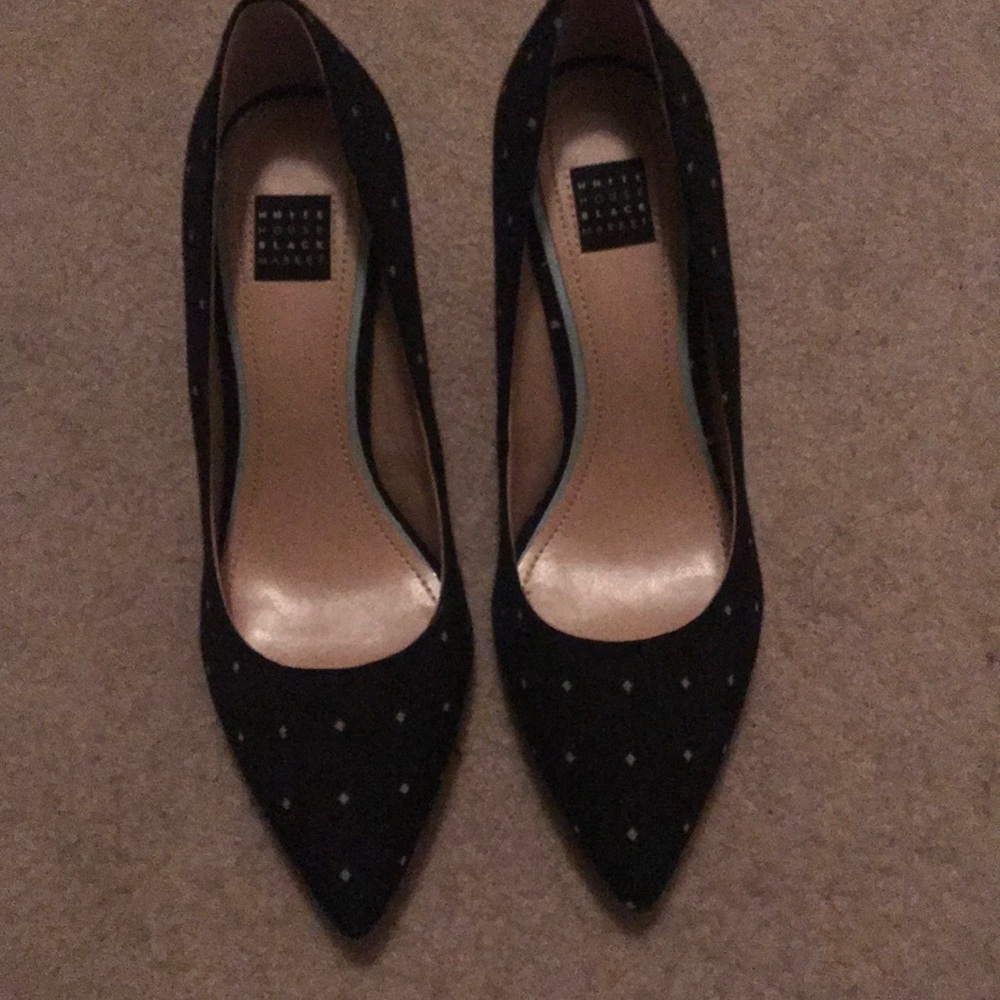 Black 4 inch pumps with white polka dots.